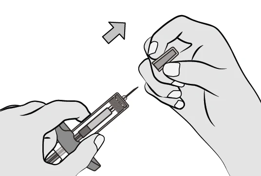 Description : A close-up of a hand holding a syringe

Description automatically generated